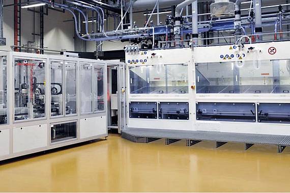 Electrotechnical production with conductive floor coating